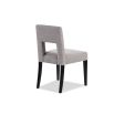 Light grey dining chair with square cut out shape in backrest and luxurious linen upholstery