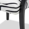 Black and white dining chair upholstered in modern graphic printed fabric