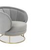 Grey velvet shapely chair with tubular brushed brass base and channelling