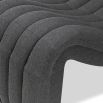 Statement curved armchair upholstered in dark grey linen