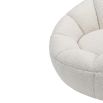 Statement boucle sand swivel chair with enveloping shell-shaped backrest