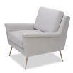 Square shaped lounge chair upholstered in grey velvet with brass legs