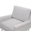 Square shaped lounge chair upholstered in grey velvet with brass legs