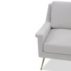 Square shaped lounge chair upholstered in grey velvet with brass legs