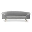 A stylish curved sofa by Liang & Eimil with a grey velvet upholstery and polished brass legs