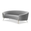 A stylish curved sofa by Liang & Eimil with a grey velvet upholstery and polished brass legs