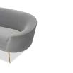 A stylish curved sofa by Liang & Eimil with a grey velvet upholstery and polished brass legs