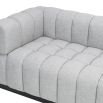 A luxury sofa by Liang & Eimil with a deep buttoned design and gorgeous grey upholstery