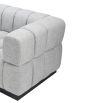 A luxury sofa by Liang & Eimil with a deep buttoned design and gorgeous grey upholstery