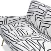 A statement sofa with a stylish zebra print upholstery