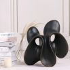 Smooth abstract black sculpture with curved design