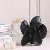 Smooth abstract black sculpture with curved design