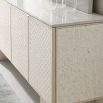 Glamorous sideboard wrapped in a pearlescent shell, presented in a basketweave pattern