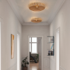 Round wall sconce with a delicate cut-out wooden surround