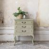 Three drawer classic design bedside table with ornate detailing