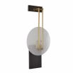 Elegant sconce light with slim brass metalwork and frosted grass