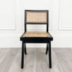 A gorgeous classic black rattan dining chair 