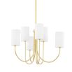 Sleek golden chandelier with multiple white linen shades