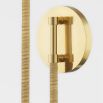 Wall sconce with gold delicate gold fixture and white linen shade