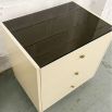 Ivory coloured three drawer bedside table with chocolate coloured details