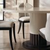 Enchanting round dining table in cream finish and dark wood base