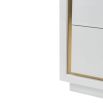 High gloss white lacquer chest of drawers with brass frame