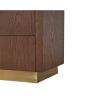 Light brown chest of drawers with brass handles and base