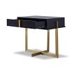 A sophisticated bedside table by Liang & Eimil with a black and brass finish