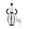 A stylish decanter by Jonathan Adler with a curvaceous silhouette and gold accents