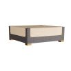 Stylish table in neutral leather with stitched top, waterfall edge, and brass legs