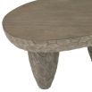 Kidney-shaped outdoor coffee table with smooth top and carved underside