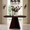 Angular art deco inspired square dining table in dark reddish wood finish