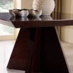 Angular art deco inspired square dining table in dark reddish wood finish