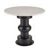 Round topped marble table with sculptural black base