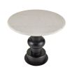 Round topped marble table with sculptural black base