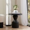 Round wooden side table with black finish and etched details