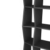 Geometric black wooden bookcase with shelving of varied depths
