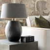 Large black metal table lamp with organic textured finish, shade not included