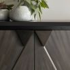 Sleek grey cabinet with two doors and triangular handle detailing