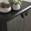 Sleek grey cabinet with two doors and triangular handle detailing