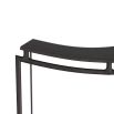 Industrial and sculptural sling-like counter stool constructed of blackened iron