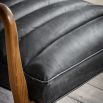 Leather armchair with deep ridging and wooden frame