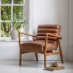 Leather armchair with deep ridging and wooden frame