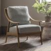 Chair with exposed wooden frame, padded seat and backrest upholstered in sleek linen