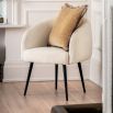 Faux sheepskin tub chair with simple black legs