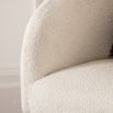 Faux sheepskin tub chair with simple black legs