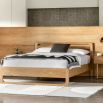 Stylish wooden double bed with exposed corners