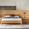 Stylish wooden double bed with exposed corners