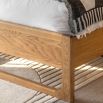 Stylish wooden double bed with exposed corners