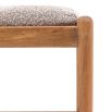 Slender wooden bench with boucle finish seat